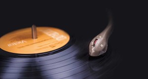 Spotify Dominates Poll As Most Popular Music Tool Vinyl record close-up showing the stylus and the rings of the vinyl record shimmering in the light.