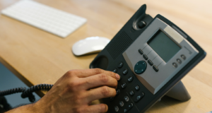 How to Find the Best Internal Telephone System Business Telephone - Person Dialing the Telephone