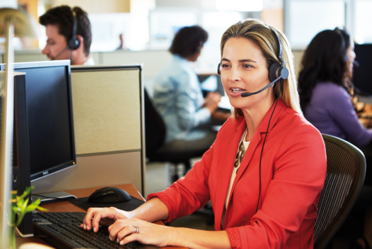 What are the Best Office Headsets for Call Centres, Receptions and Home Offices? Lady wearing a Jabra Biz 2400 Wired Office Headset