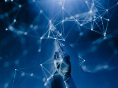 How A.I. is changing the Contact Centre Industry An abstract imagerepresenting Artificial Intelligence. A dark blue gradient that seems like it could be underwater with lots of nodes and interconnecting lines along witth a robotic hand reaching up from the bottom and pointing into the nodes.